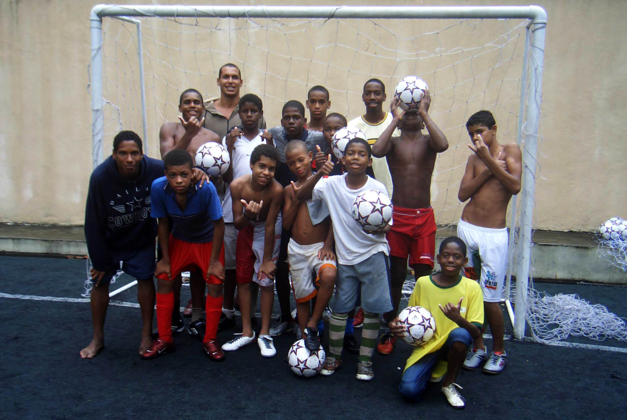 footballers gathered in front of goalposts